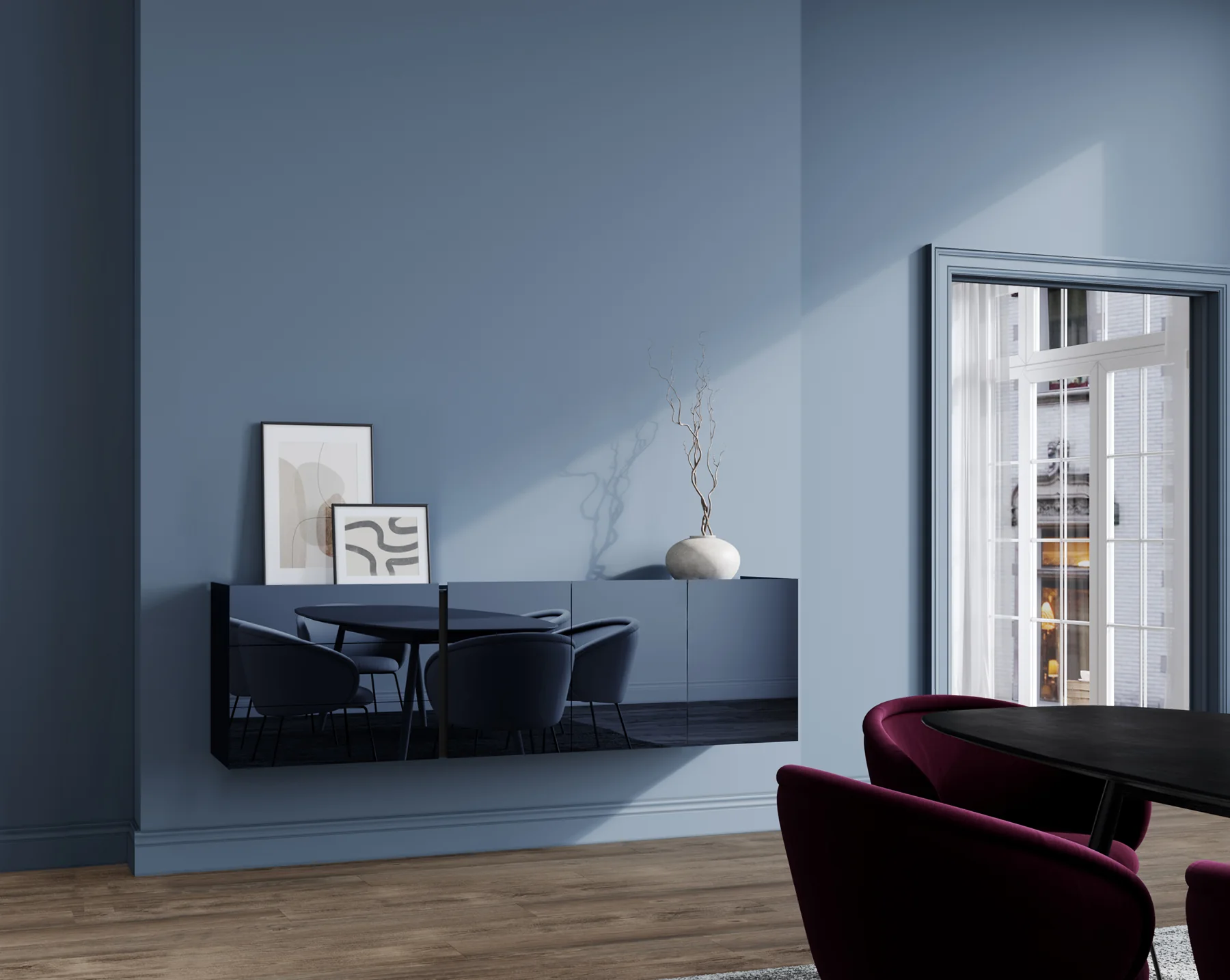 interlübke jorel als dunkles Sideboard vor einer blauen Wand neben einem Fenster